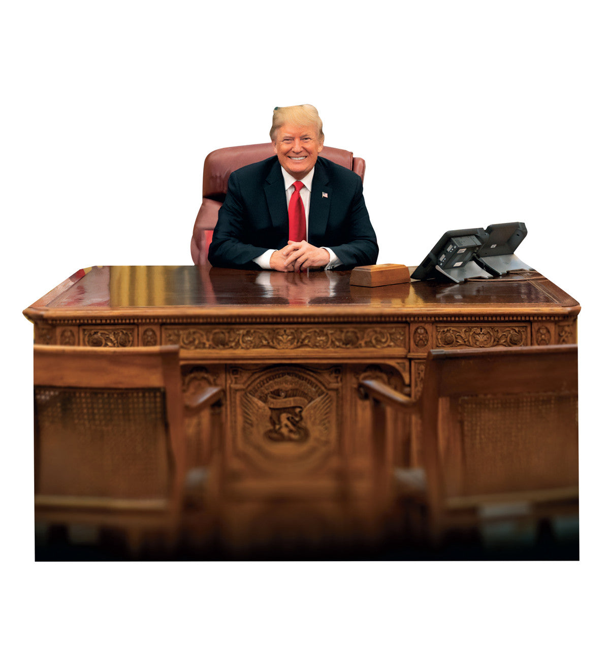 President Trump sitting behind the Resolute Desk